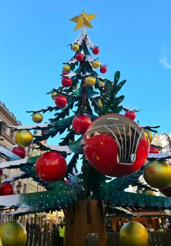 Christmas tree ride in daylight showing the decorated tree and cabin ring